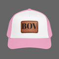 Pink and white cap with a brown leather patch featuring a logo on a white background